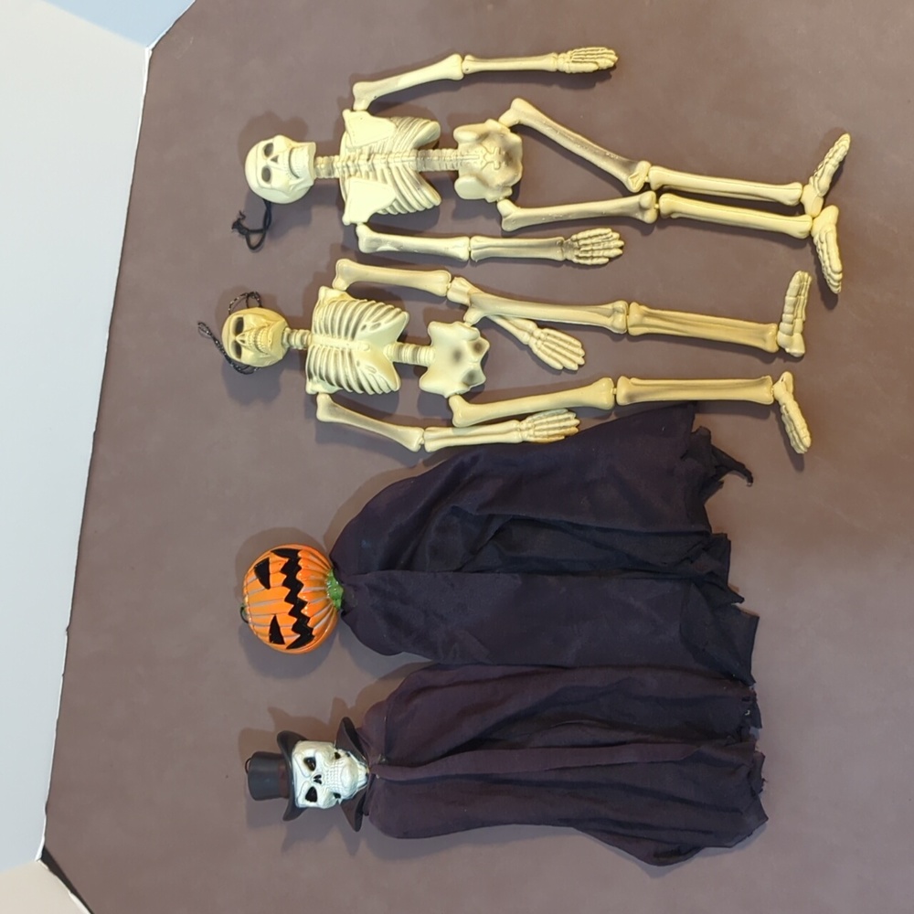 Paper magic group Halloween skeletons Jack o lantern skull top hat wall hangers